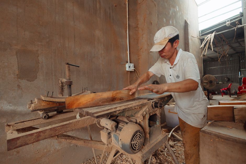 Skilled carpenter working wood during a turnkey renovation